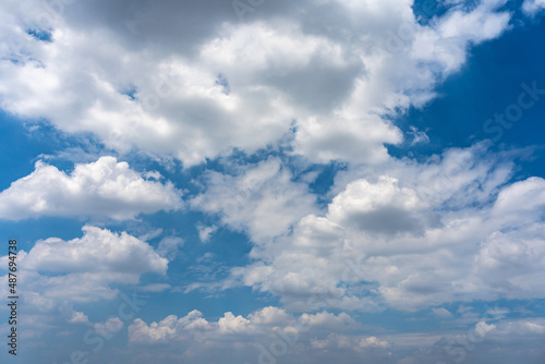 Beautiful blue sky background with white clouds floating