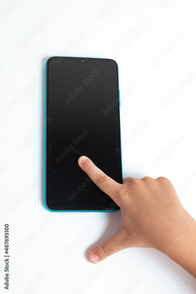 Child holding cellphone over white background Child holding cellphone over white background