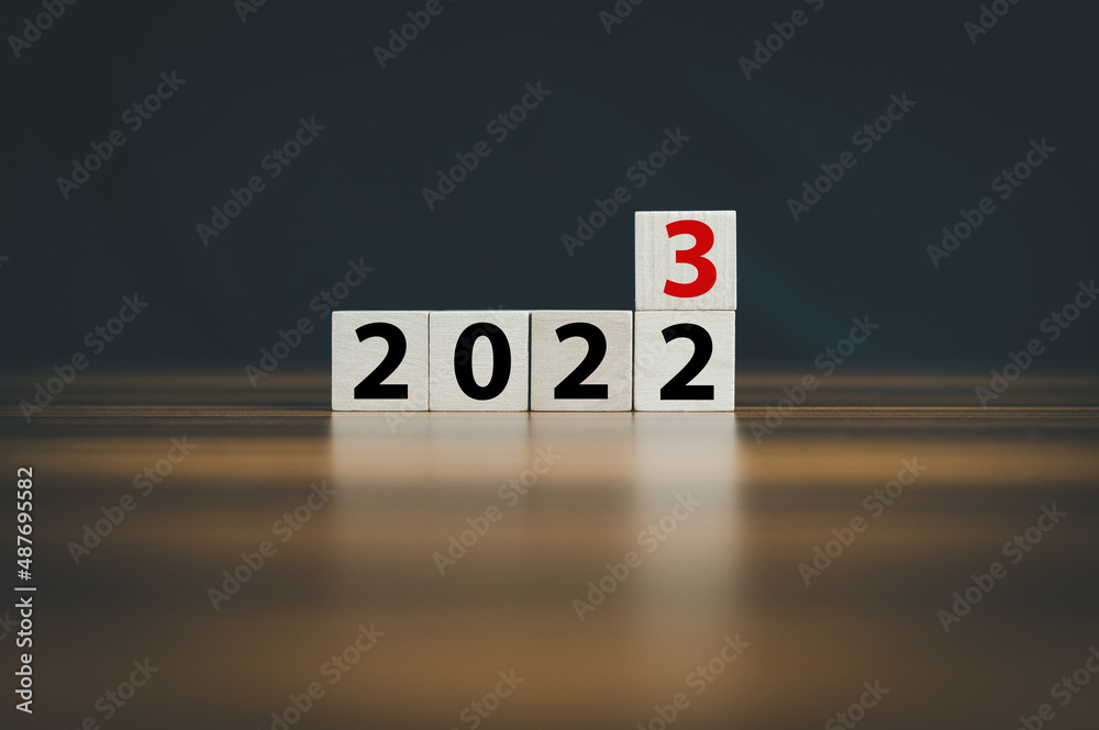 wooden cubes 2022 and 2023 concept business change to new success