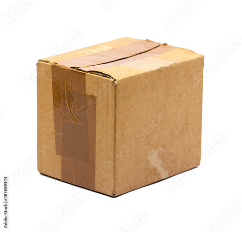 Old brown cardboard box isolated on white background.