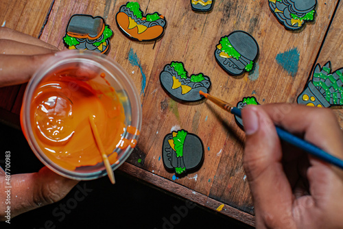 Craft pins made of acrylic and colored using enamel paint, all done manually in a home workshop photo