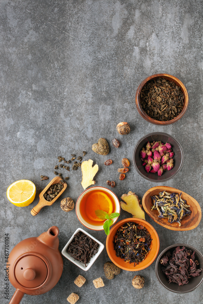 Set natural dried tea and teapot. Teatime. Tea ceremony concept. Top view. Flat lay.