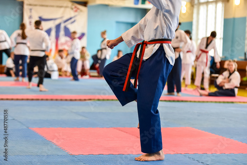 Taekwondo kids athlete. Performing an exercise during a children's taekwondo tournament