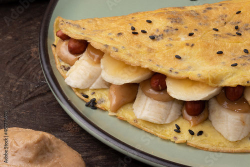 Close up of crepioca stuffed with banana and peanut butter. photo