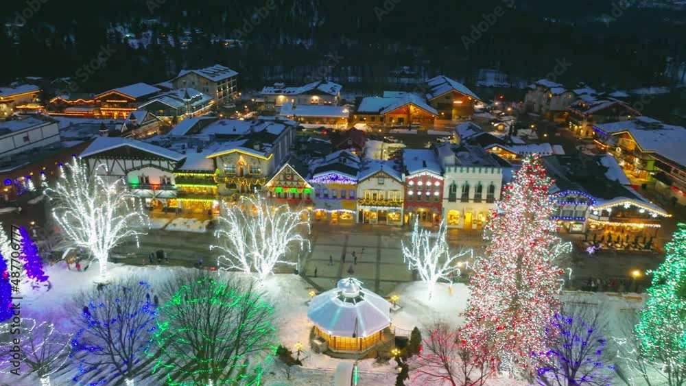 Cinematic 4K aerial drone night pan shot of decorated Front St in ...