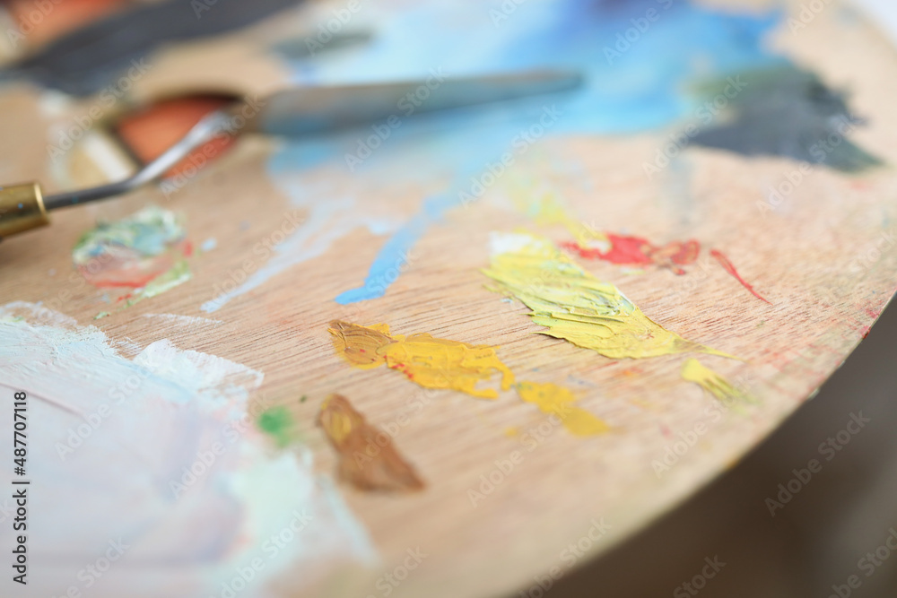 Artists palette with multiple colors and spatula Artists palette with multiple colors and spatula