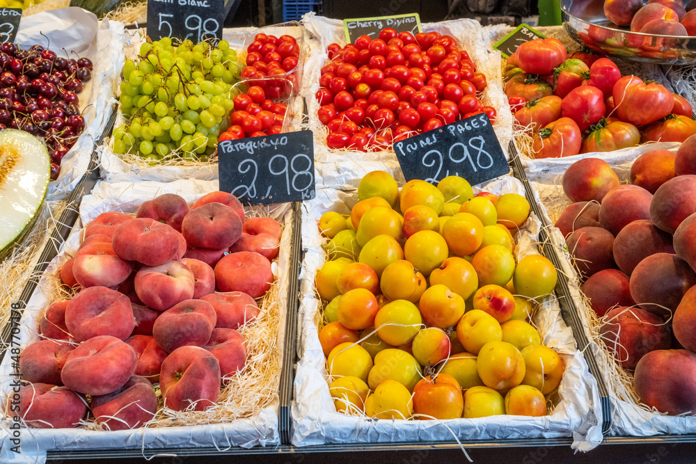 Peaches, plums and tomatoes for sale at a market