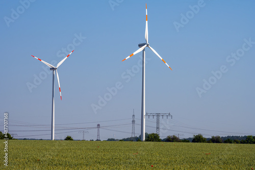 Wind turbines and overhead electric power lines seen in Germany