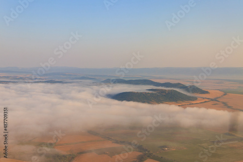 Aerial view of the mountains and fields in Bulgaria. View from a plane