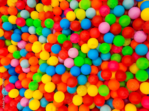 Background of many plastic colorful balls in ball pool in a children s game room