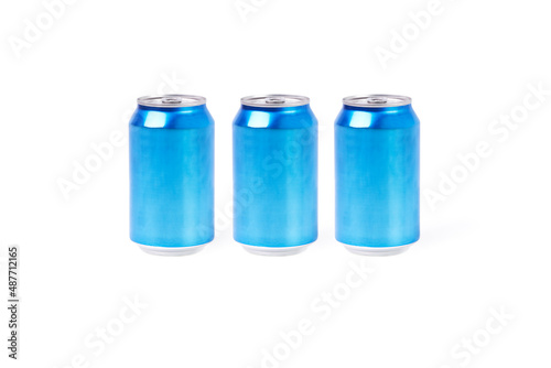 Three light blue aluminum cans on a white background. Drink concept