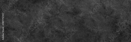 Obraz  z motywem Dark black grey background marbled stone wall or rock industrial texture in website banner header backdrop design