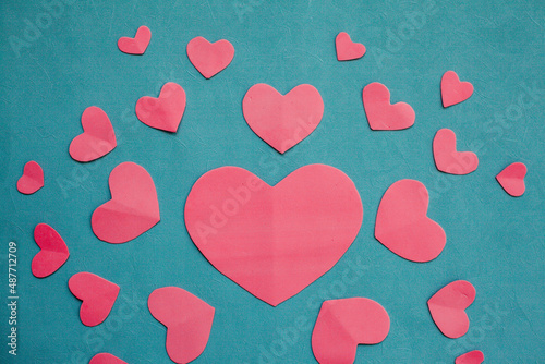 Top view photo with Valentine's Day hearts on an isolated blue background with a copy space

