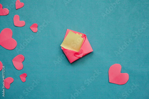 Top view photo with Valentine's Day hearts on an isolated blue background with a copy space
