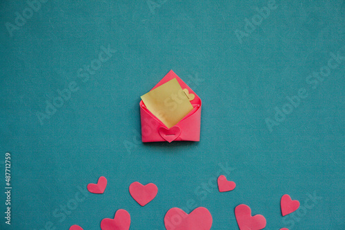 Top view photo with Valentine's Day hearts on an isolated blue background with a copy space
