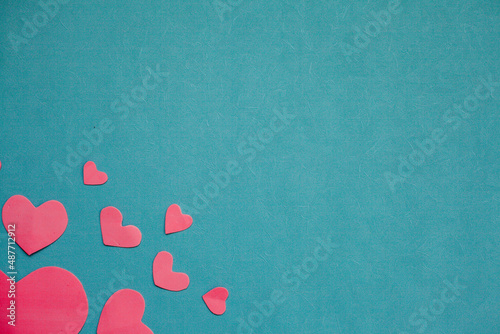 Top view photo with Valentine's Day hearts on an isolated blue background with a copy space
