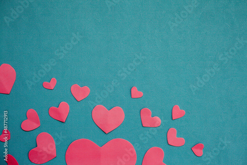 Top view photo with Valentine's Day hearts on an isolated blue background with a copy space

