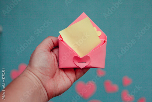 Top view photo with Valentine's Day hearts on an isolated blue background with a copy space

