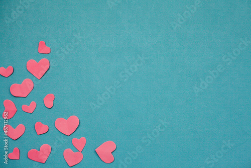 Top view photo with Valentine's Day hearts on an isolated blue background with a copy space
