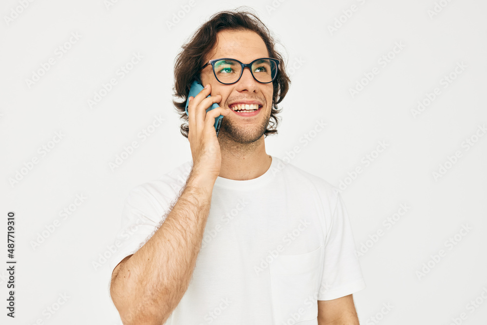 Cheerful man talking on the phone technologies isolated background
