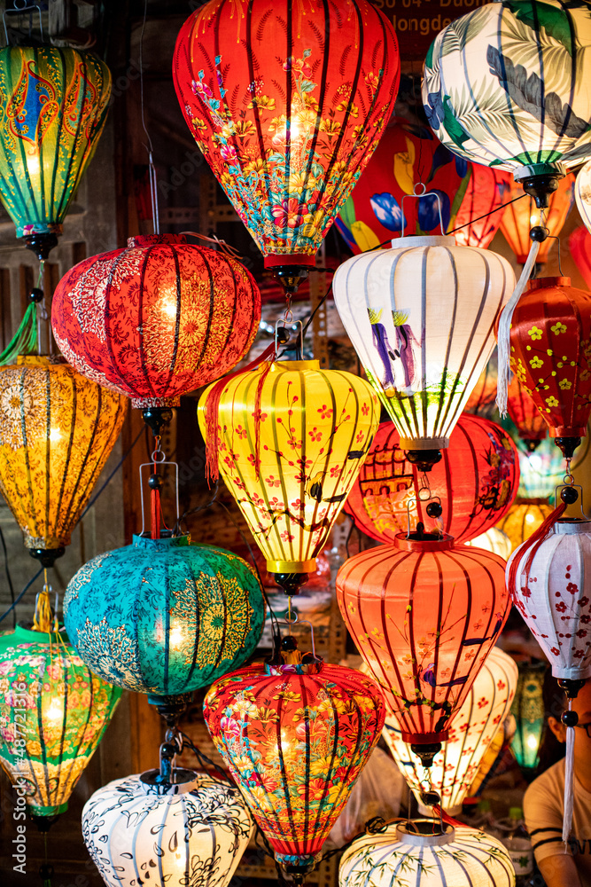 Paper lanterns lit up at night in the markets of Hoi An, Vietnam