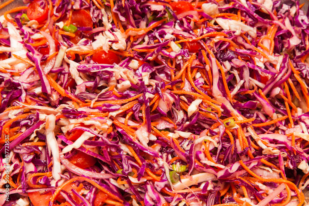 Fresh salad with cabbage, carrots and onions.