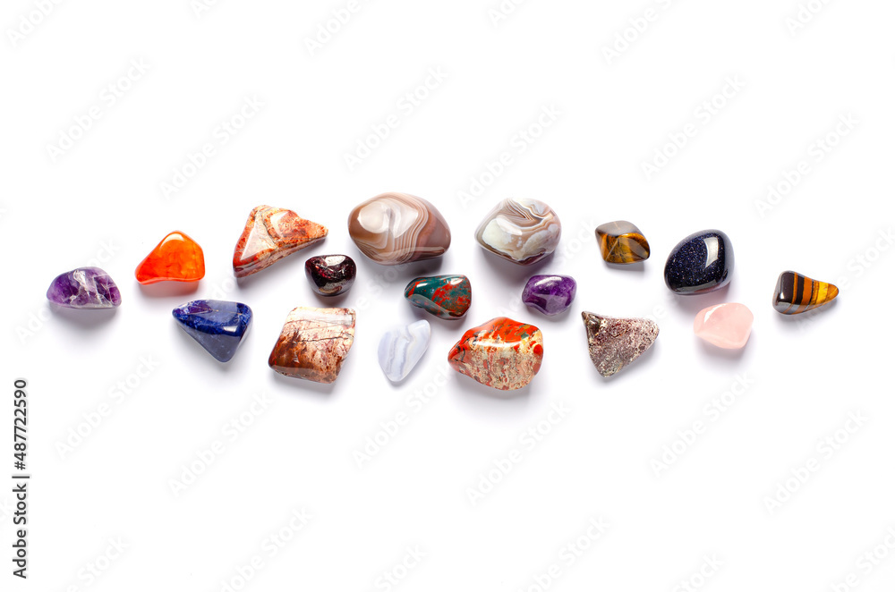 Mineral stones on a white background. The concept of using minerals and crystals in astrology and alternative or complementary medicine. Copy space. Mineral stones on a white background. The concept of using minerals and crystals in astrology and alternative or complementary medicine. Copy space.