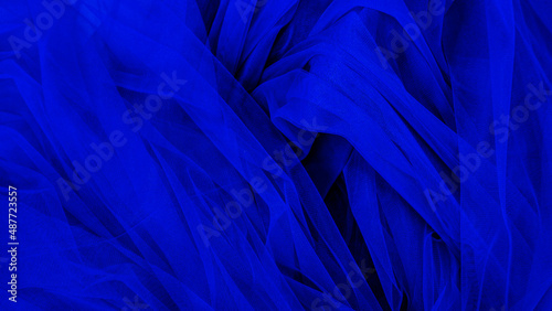 Background crumpled tulle fabric beautiful blue color.