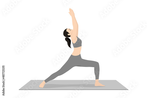 Warrior Pose I. Beautiful girl practice Virabhadrasana I. Young attractive woman practicing yoga exercise. working out, black wearing sportswear, grey pants and top, indoor full length, calmness photo