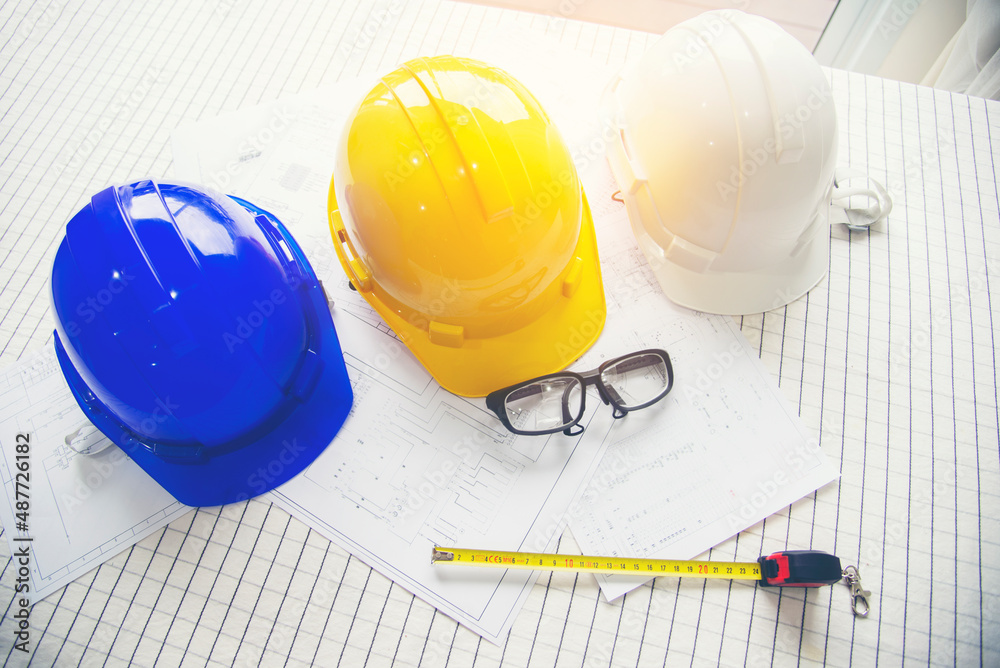Architect at work in a construction site Engineers man construction safety work concept and construction city .Engineer Concept Architect at work in a construction site Engineers man construction safety work concept and construction city .Engineer Concept