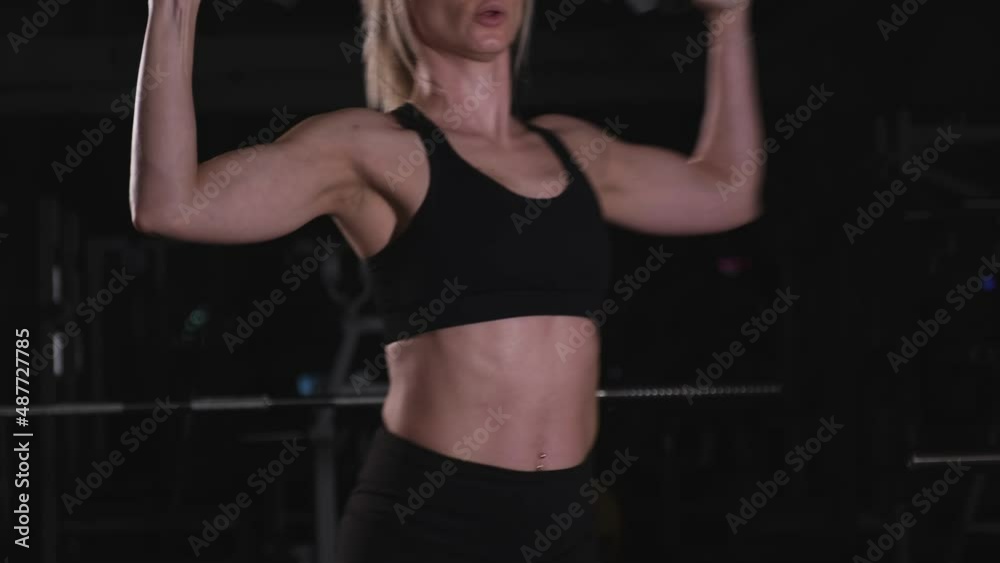 Female press training with dumbbells in hands Female press training with dumbbells in hands