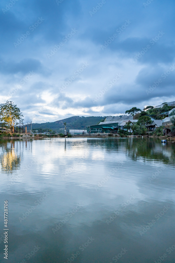 An Son Ho lake in sunset, Da Lat, Viet Nam. Beautiful landscape with clouds and misty. Panorama