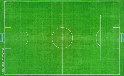 Top view of football ar soccer field with green grass, top view