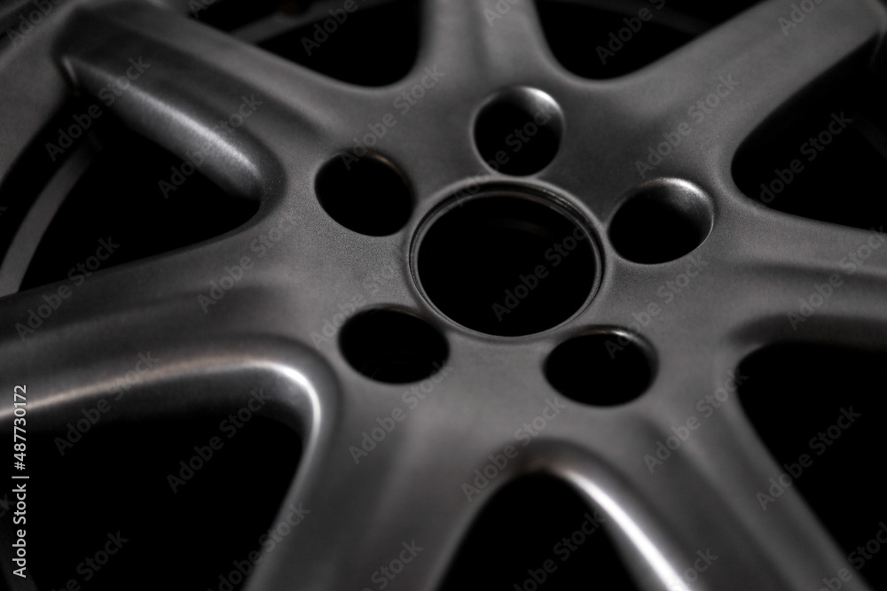 Grey alloy wheel or car rim close-up Grey alloy wheel or car rim close-up
