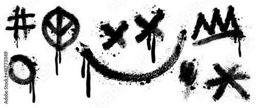 Set of black graffiti spray pattern. Collection of symbols  smiley  circle  dot and stroke with spray texture. Elements on white background for banner  decoration  street art and ads.