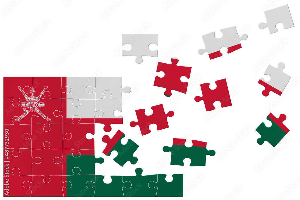 Broken puzzle- game background in colors of national flag. Oman Broken puzzle- game background in colors of national flag. Oman