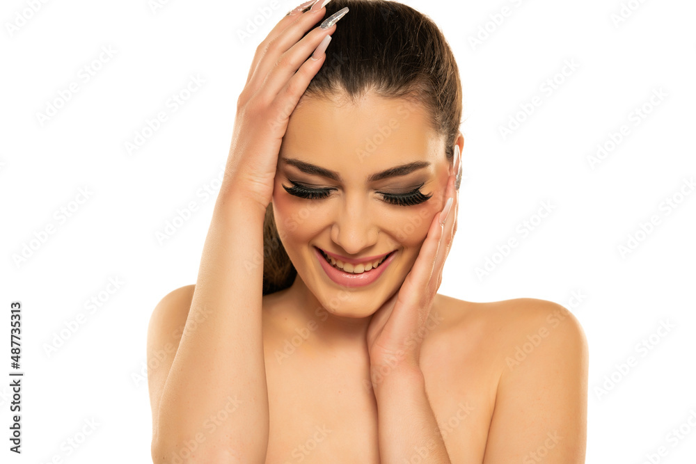 Beautiful happy brunette woman with beauty lashes closed eyes, and pink lipstick Beautiful happy brunette woman with beauty lashes closed eyes, and pink lipstick