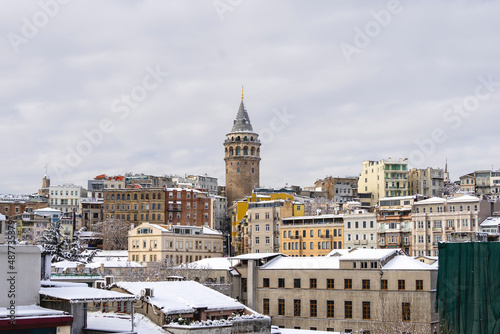 Galata Tower on winter day covered with snow. Galata Tower is a medieval stone tower in the Galata quarter of Istanbul, Turkey.