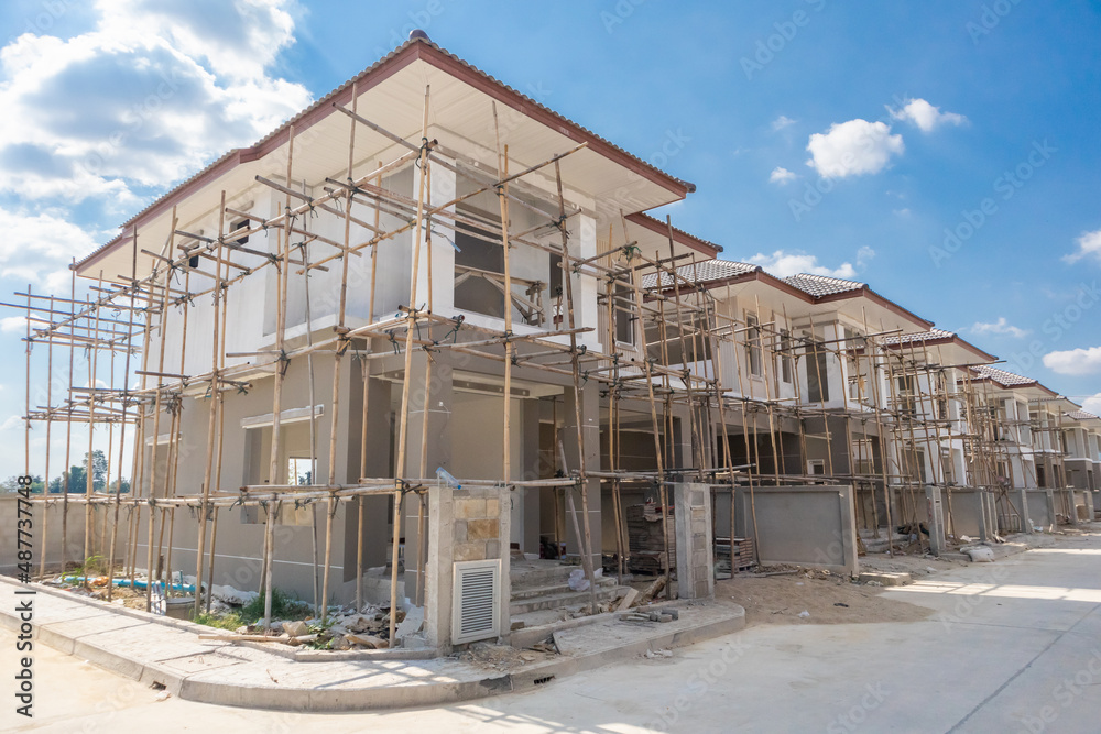Obraz premium construction residential new house in progress at building site housing estate development