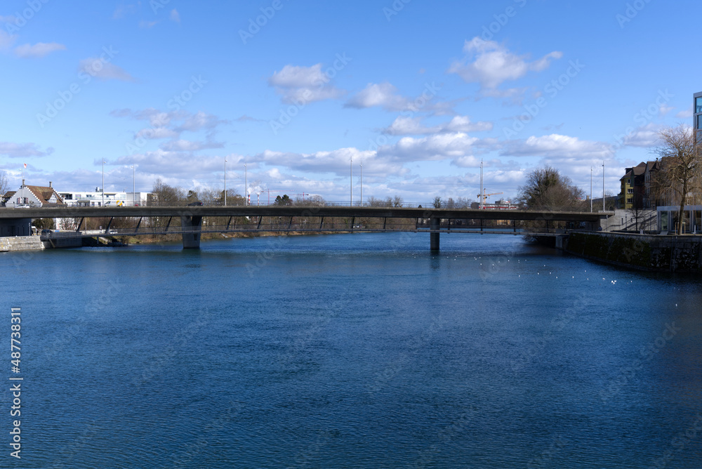 River Aare at City of Solothurn with Rötibrücke (Röti Bridge) in the background on a sunny winter day. Photo taken February 7th, 2022, Zurich, Switzerland.