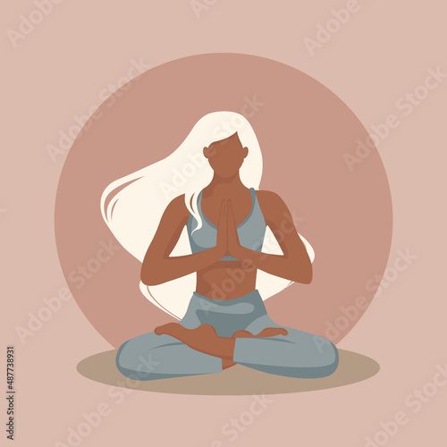  Yogi girl with white hair in the lotus position and the grey suit  © Arina