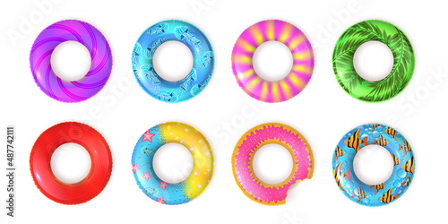 Realistic inflatable rubber swimming rings top view. Kids lifebuoy for pool or sea water with fish and doughnut design. Swim ring vector set