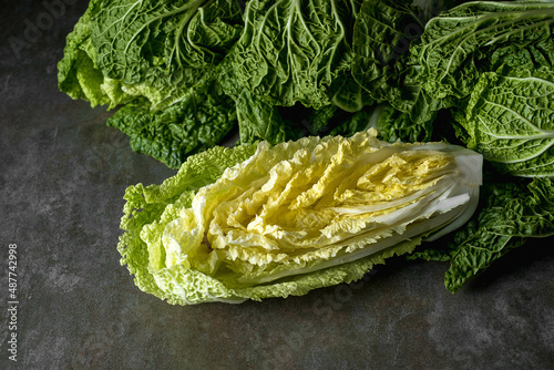 Napa cabbage or Chinese cabbage Fresh ripe chinese cabbage on a stone table, top view