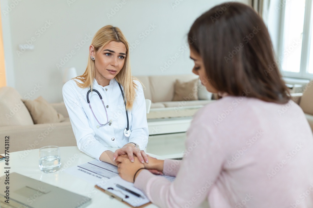 Healthcare and medical concept - doctor with patient in hospital. Doctor working in the office and listening to the patient, she is explaining her symptoms, healtcare and assistance concept