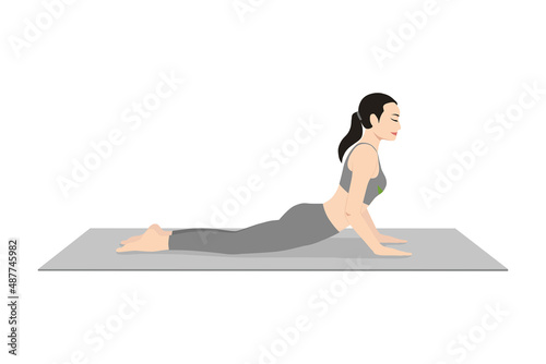 Cobra Pose Elbows Bent. Beautiful girl practice Bhujangasana Elbows Bent. Young attractive woman practicing yoga exercise. working out, black wearing sportswear, grey pants and top, indoor full length