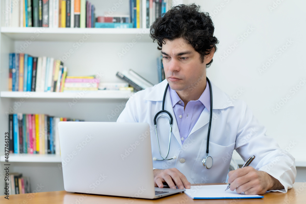 Caucasian doctor or scientist working at desk at office Caucasian doctor or scientist working at desk at office