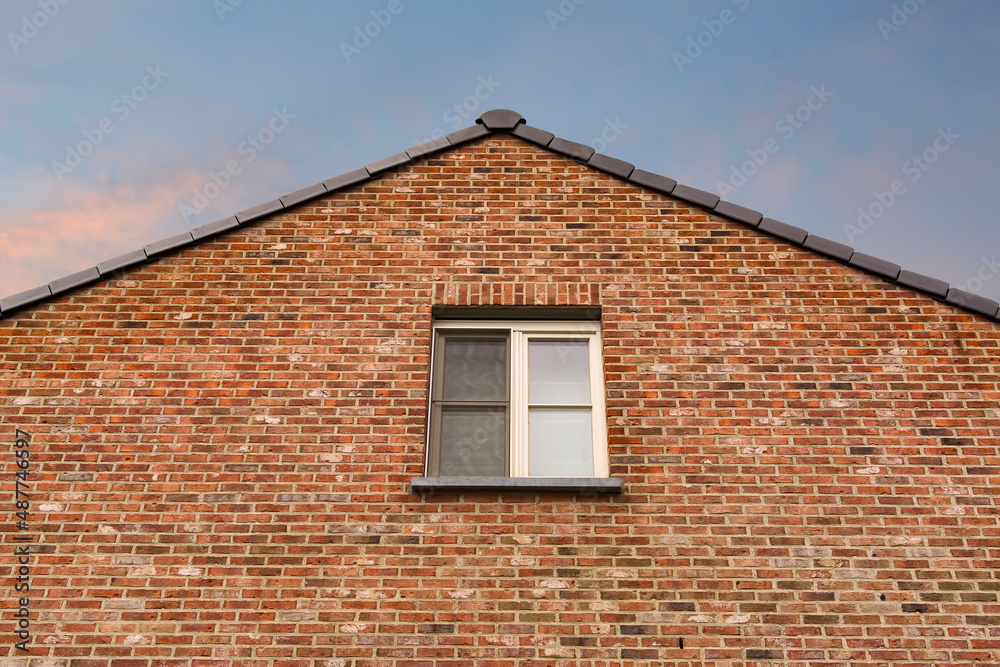 Gabled roof old brick house in Gavere town, located in the Belgian province of east flanders, Belgium Gabled roof old brick house in Gavere town, located in the Belgian province of east flanders, Belgium