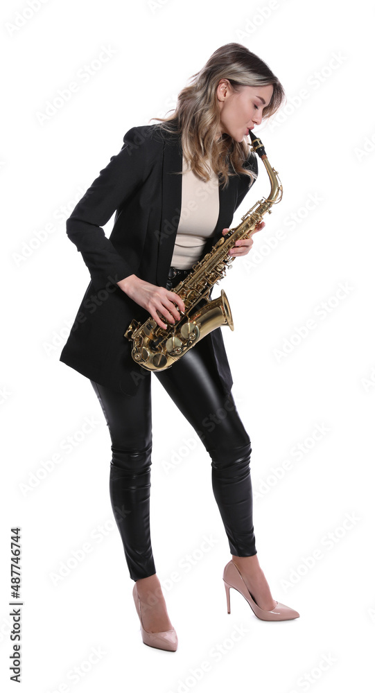 Naklejka premium Beautiful young woman in elegant suit playing saxophone on white background