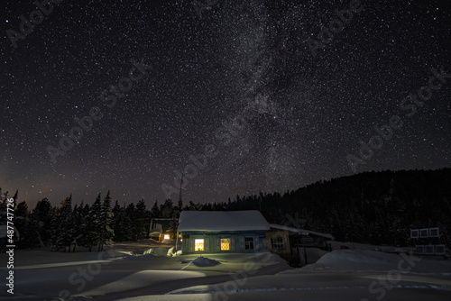Milky way in the night sky over the house