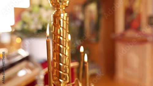 View at the Many ortodox Church Candles Burning in the Temple. The Holy bible, font for the sacrament , Orthodox item, Orthodox cross in church, Christianity concept photo